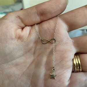 Silver infinity and star necklace